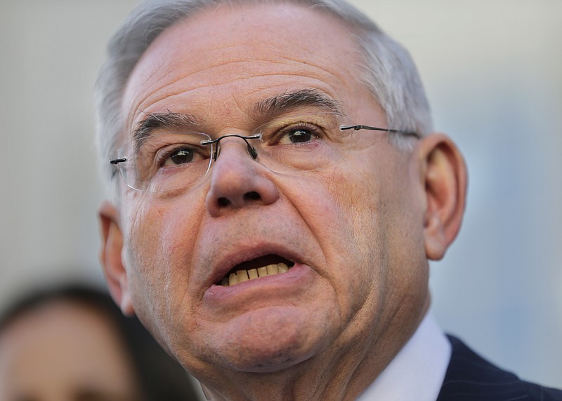 FILE - IN this Nov. 16, 2017 file photo, Democratic Sen. Bob Menendez becomes emotional as he speaks to reporters in front of the courthouse in Newark, N.J.  Federal prosecutors decided Wednesday, Jan. 31, 2018 not to retry  Menendez on corruption charges, lifting the legal cloud hanging over the New Jersey Democrat as he gears up for re-election this year.  (AP Photo/Seth Wenig, File)
