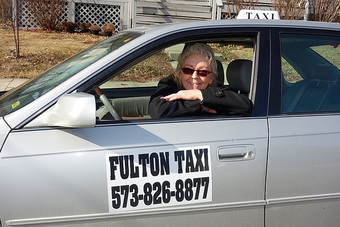 Cathy Reichert, new owner of Fulton Taxi, is ready and willing to give rides 24/7. She can travel regionally as well as to major airports, she said.