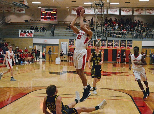 DaMani Jarrett of the Jays goes up for a shot during Tuesday night's game against Rock Bridge at Fleming Fieldhouse.