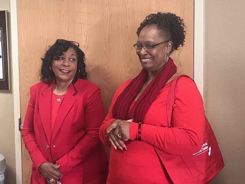Carolyn Moore visits with Vickie Waller at a Go Red for Women event Friday at the Wadley Senior Clinic. Attendees received information about heart disease and heart-healthy living as well as free health screenings.