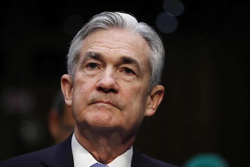 FILE- In this Nov. 28, 2017, file photo, Jerome Powell, President Donald Trump's nominee for chairman of the Federal Reserve, sits in the audience before being called to testify during a Senate Banking, Housing, and Urban Affairs Committee confirmation hearing on Capitol Hill in Washington. The Senate on Tuesday, Jan. 23, 2018, approved Powell to be the next chairman of the Federal Reserve beginning next month. (AP Photo/Carolyn Kaster, File)