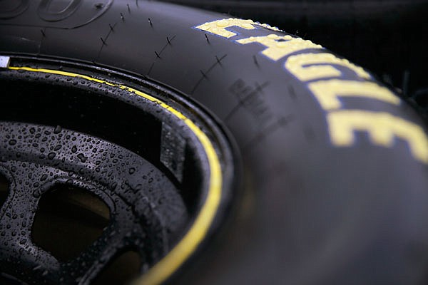 Water beads up on a rim and tire during a rain delay a NASCAR race last season.