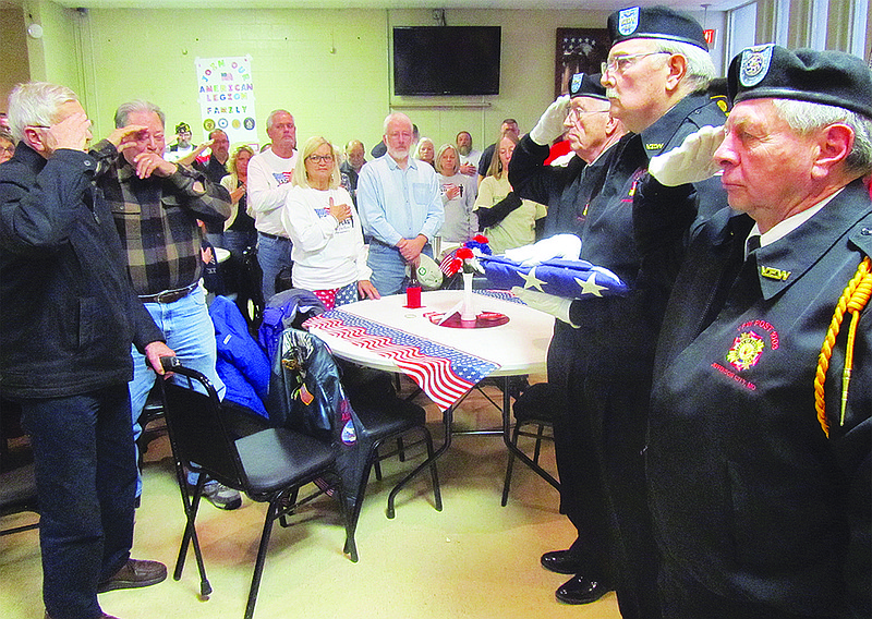 American Legion Post 5 members conduct a folding of the flag ceremony at Sunday's "I Stand Up for the Flag" event at the legion. More than 200 people attended the alternative Super Bowl event, which was held as a reaction to NFL players kneeling during the National Anthem.