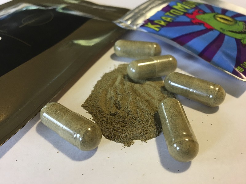 FILE - In this Sept. 27, 2017 photo, kratom capsules are displayed in Albany, N.Y. U.S. health authorities say  kratom, a herbal supplement promoted as an alternative pain remedy, contains the same chemicals found in opioids, the addictive family of drugs at the center of a national drug abuse crisis. The Food and Drug Administration analysis, published Tuesday, Feb. 6, 2018, makes it more likely that kratom could be banned by the federal government. (AP Photo/Mary Esch, File)