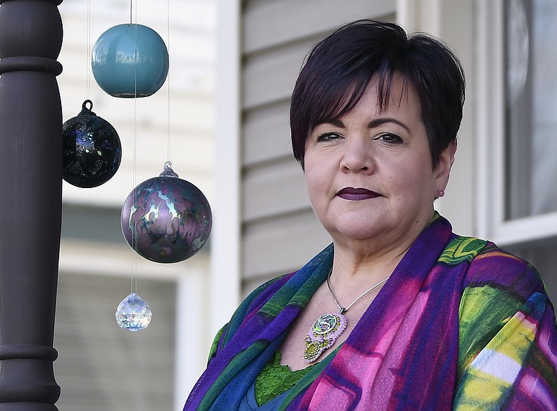 In this Feb. 3, 2018 photo, Schenectady City Councilwoman Leesa Perazzo poses at her home in Schenectady, N.Y.  She lived for decades with the personal impact of being raped at 16, and two years ago a newspaper published her account. She thought telling the story could help other victims but worried that people might think she was lying to get attention, though her attacker had been prosecuted.  Disclosing her own rape “was terrifying and amazingly empowering, all at the same time,” Perazzo says, but she’s glad she did it." AP Photo/Hans Pennink)