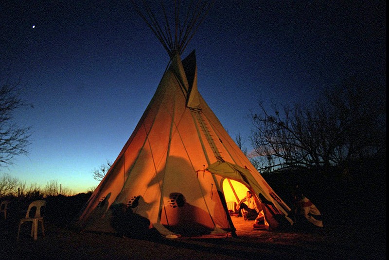  In this Feb. 17, 1996 file photo, members of the Native American Church prepare for a prayer meeting in Mirando City, Texas. The Native American Church of North America has settled a lawsuit in late Jan. 2018, against the Transportation Security Administration, leading to more training for agents on how to screen religious items. The training will happen at airports that church members typically use to travel. (Joyce Marshall/Star-Telegram via AP, File)