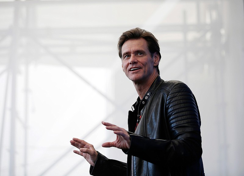 In this Sept. 5, 2017 file photo, actor Jim Carrey poses for photographers during the photo call of the film "Jim & Andy: The Great Beyond - The Story of Jim Carrey & Andy Kaufman Featuring a Very Special, Contractually Obligated Mention of Tony Clifton," at the 74th edition of the Venice Film Festival, in Venice, Italy. Carrey, said on Twitter on Tuesday, Feb. 6, 2018, that he's dumping his Facebook stock and deleting his page because the social media giant profited from Russian interference in the U.S. presidential election via spreading false news with Russian origins, and says they're still not doing enough to stop it. The 56-year-old Carrey encouraged other investors and users to do the same. (AP Photo/Domenico Stinellis, File)