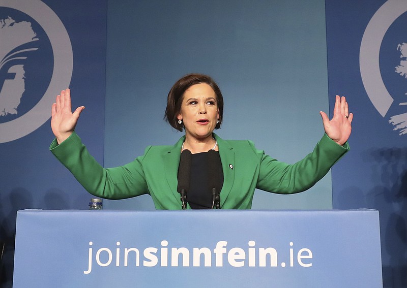 Mary Lou McDonald acknowledges the applause of delegates after she was elected as Sinn Fein's president at the party's special conference at the RDS in Dublin, Ireland, Saturday Feb. 10, 2017. Gerry Adams’ three decades at the helm of the Sinn Fein party have come to an end with Mary Lou McDonald taking over as leader. McDonald, the first woman to lead the party, is also the first Sinn Fein leader with no direct connection to Ireland’s period of violence known as the Troubles. (Niall Carson/PA via AP)
