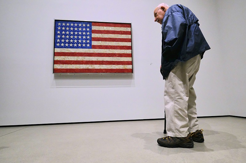 This Wednesday, Feb. 7, 2018 photo shows Allon Schoener from The Cosmopolitan Observer joins journalists during a media preview of an exhibition by artist Jasper Johns at The Broad in Los Angeles. (AP Photo/Richard Vogel)