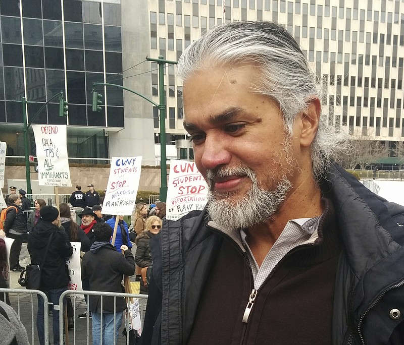Immigration activist Ravi Ragbir appears at a rally given in his honor Saturday, Feb. 10, 2018 in New York. Ragbir, who is from Trinidad and Tobago, faced deportation on Saturday until a judge ruled Friday that he could stay in the country while a lawsuit filed on his behalf is argued. (AP Photo/Julie Walker)