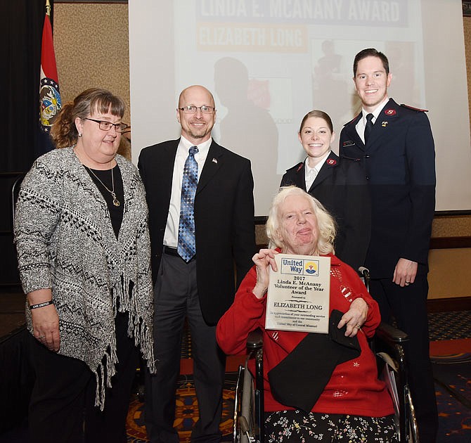 Longtime Salvation Army bell ringer Elizabeth Long, center, received the Linda E. McAnany Award on Friday during the United Way annual meeting for her dedication to the agency, having raised more than $180,000 during her 28 years volunteering.
