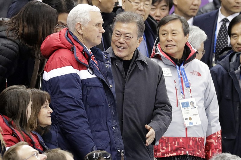 In this Feb. 10, 2018, photo,  Vice President Mike Pence, center left and South Korean President Moon Jae-in attend the ladies' 500 meters short-track speedskating in the Gangneung Ice Arena at the 2018 Winter Olympics in Gangneung, South Korea. The U.S. is open for talks without preconditions with nuclear North Korea, Pence has declared, subtly shifting White House policy after Olympics-inspired gestures of respect between the rival Koreas. (AP Photo/Bernat Armangue)