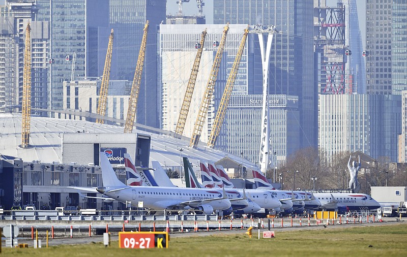 Planes on the apron at London City Airport which has been closed after the discovery of an unexploded Second World War bomb was found in the nearby River Thames, Monday Feb. 12, 2018. (Dominic Lipinski/PA via AP)