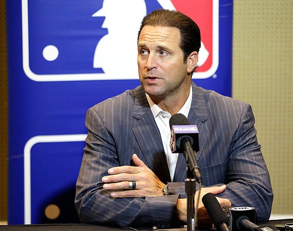 In this Dec. 13, 2017, file photo, Cardinals manager Mike Matheny talks with members of the media at the Major League Baseball winter meetings in Orlando, Fla.