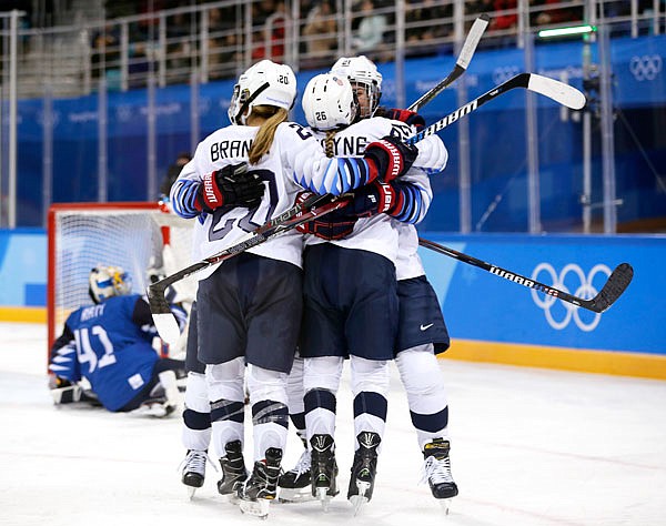 Kendall Coyne (second from left), of the United States, celebrates after scoring a goal against Finland during the second period of the women's hockey preliminary round Sunday at the Winter Olympics in Gangneung, South Korea.