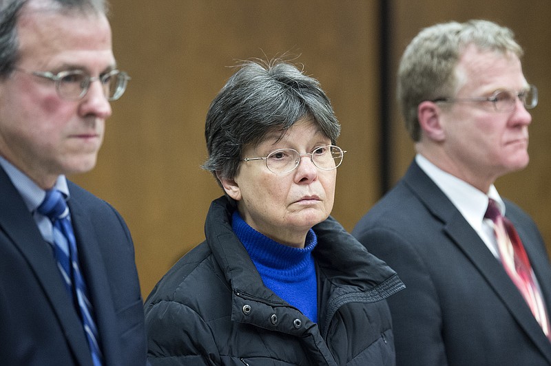 Linda Kosuda-Bigazzi, 70, center, appears at Bristol Superior court for a hearing on a murder charge, Tuesday, Feb. 13, 2018 in Bristol, Conn.  Linda Kosuda-Bigazzi is charged with murder in the death of her husband, Dr. Pierluigi Bigazzi, a professor of laboratory science and pathology at UConn Health.    (Patrick Raycraft/Hartford Courant via AP, Pool)