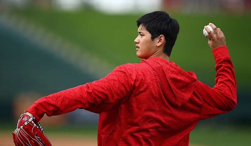 Los Angeles Angels' Shohei Ohtani throws during a spring training practice on Tuesday, Feb. 13, 2018, in Tempe, Ariz. (AP Photo/Ben Margot)