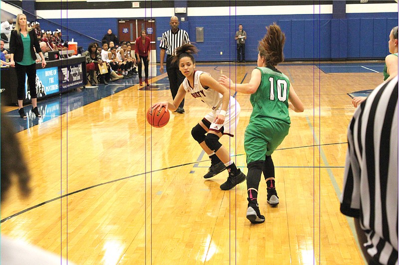 Liberty-Eylau senior guard Kaliyah Thompson dribbles against the defense of Mabank's Brianna Martin on Monday in a Class 4A bi-district girls playoff basketball game at Spring Hill High School in Longview, Texas. The Lady Leopards eliminated Mabank, 58-47.