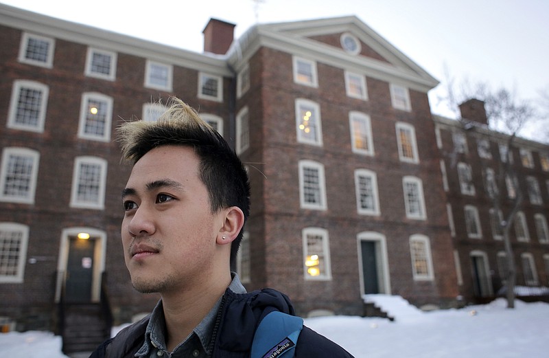 FILE - In this Feb. 14, 2017 file photo, Viet Nguyen poses for a portrait on the Brown University campus in Providence, R.I. Nguyen, now an alumnus, helped lead an effort urging Brown and other elite universities to rethink their legacy admissions policies. (AP Photo/Steven Senne, File)