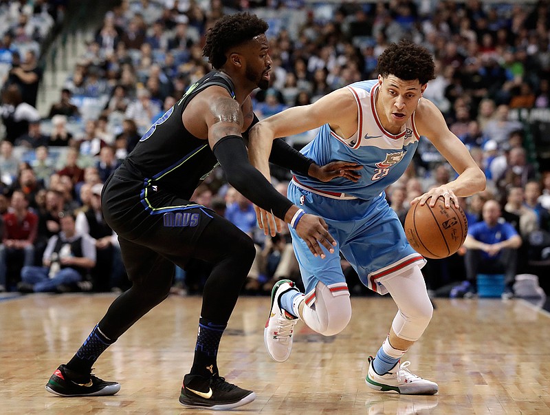 Dallas Mavericks guard Wesley Matthews (23) defends as Sacramento Kings forward Justin Jackson (25) advances the ball up court in the first half of an NBA basketball game Tuesday, Feb. 13, 2018, in Dallas. (AP Photo/Tony Gutierrez)