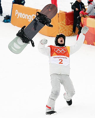 Shaun White celebrates winning gold today after his run during the men's halfpipe finals at Phoenix Snow Park at the Winter Olympics in Pyeongchang, South Korea.
