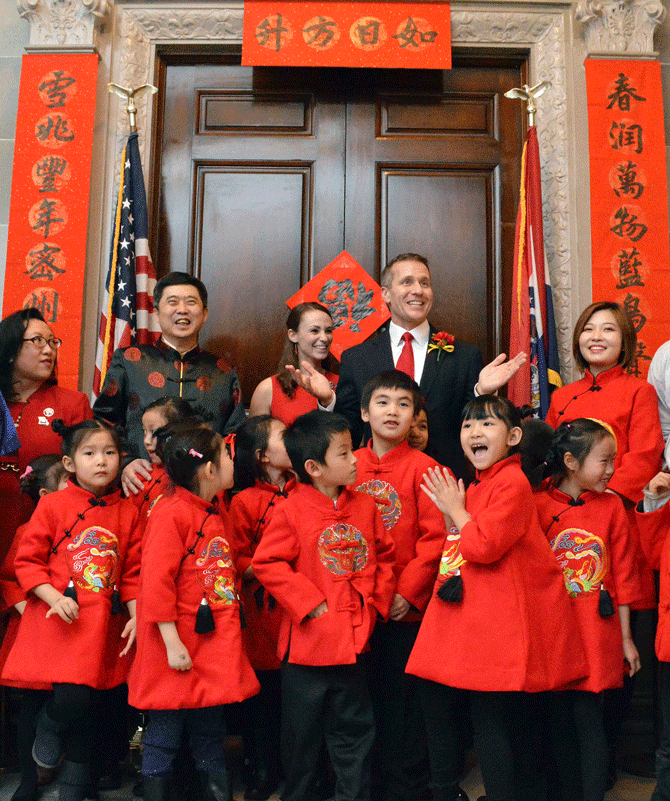 Gov. Eric Greitens and first lady Sheena Greitens pose with children from the Columbia Chinese School on Thursday during a celebration of the Lunar New Year at the Capitol.