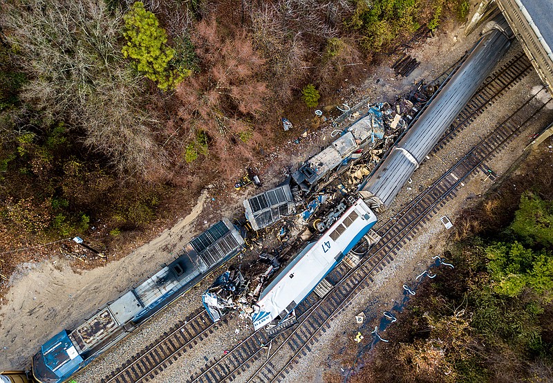 This Feb. 4, 2018, file photo shows an aerial view of the site of a fatal train crash between an Amtrak train, bottom right, and a CSX freight train, top left, in Cayce, S.C. According to a preliminary report by The National Transportation Safety Board dated Tuesday, Feb. 13, human error is likely the cause of the collision. (AP Photo/Jeff Blake, File)