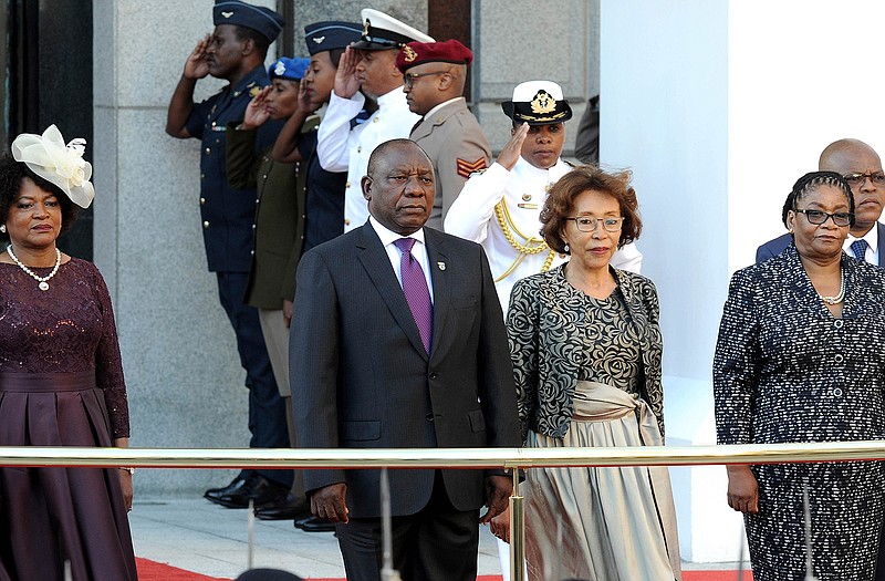 South Africa's new President, Cyril Ramaphosa, left, arrives at parliament to deliver his State of the Nation address in parliament in Cape Town, South Africa, Friday, Feb. 16, 2018. There are high expectations for Ramaphosa to curb corruption that flourished under his predecessor Jacob Zuma who resigned earlier in the week. (AP Photo/Nasief Manie)