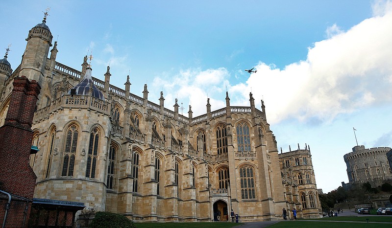 This Tuesday, Nov. 28, 2017 file photo shows a general view of St George's Chapel within the walls of of Windsor Castle, in Windsor, England. Prince Harry and his fiancee, American actress Meghan Markle, have released more details about their May 19 wedding, revealing that the event will include a carriage ride through Windsor so they can share the big day with the public. The couple will marry at noon in St George's Chapel, the 15th-Century church on the grounds of Windsor Castle that has long been the backdrop of choice for royal occasions. Harry's grandmother, Queen Elizabeth II, gave permission for use of the venue and will attend the wedding. (AP Photo/Alastair Grant, File)