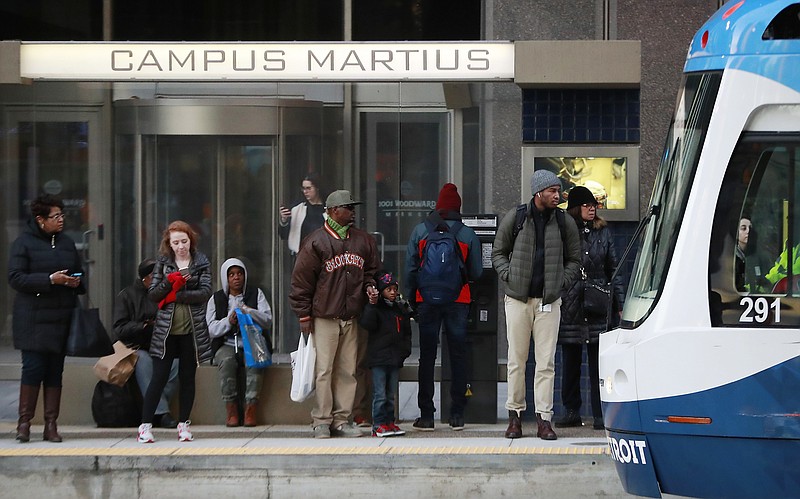 In this Jan. 26, 2018 photo, passengers wait on the QLINE transit train in Detroit. Some cities and regions are dangling racial diversity along with positive business climates, competitive tax rates and available land in pitches to lure tech companies and high-paying jobs to town. Places such as Pittsburgh, Philadelphia and Detroit are touting their populations of people of color to chief executives and other corporate officials as part of being open for business. (AP Photo/Carlos Osorio)