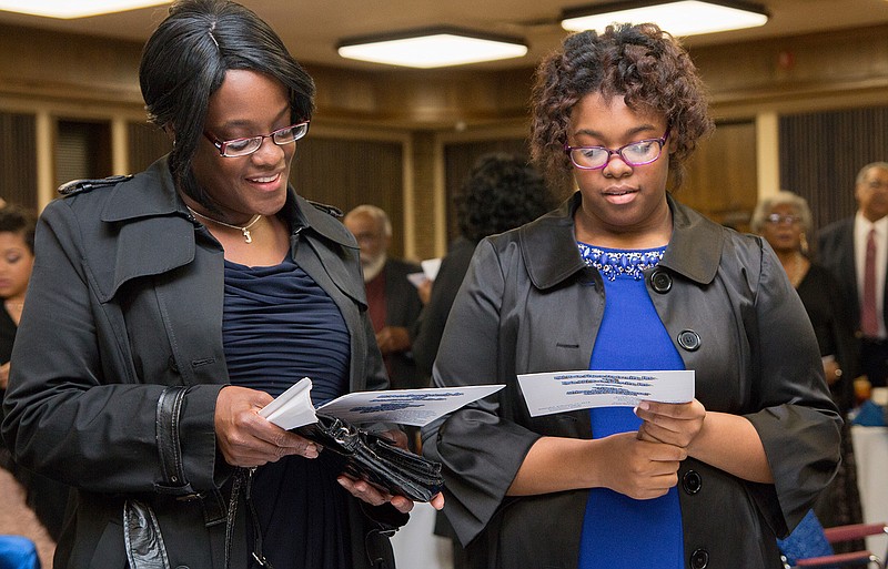 Mrs. Thompson and her daughter, Katie Thompson, sing along to "Lift Every Voice and Sing" on Saturday night during the 23nd annual Tribute to African American Women Awards Banquet at Texarkana College. This song is known by all members of the Phi Beta Sigma fraternity and Zeta Phi Beta sorority. For more coverage, see Monday's Texarkana Gazette.