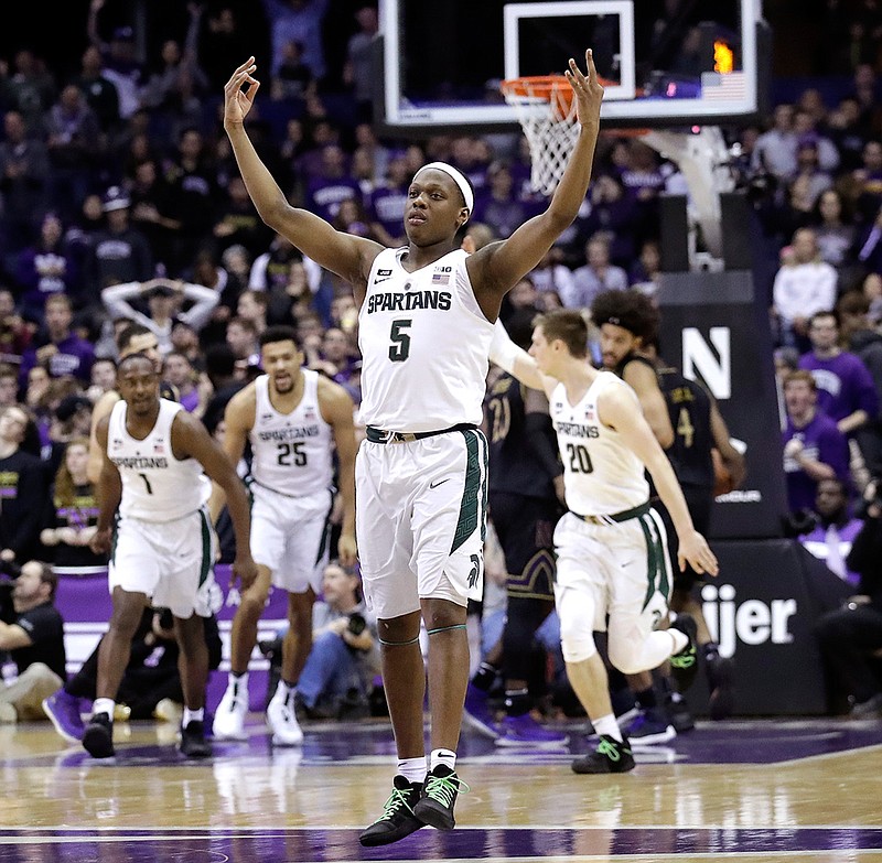 Michigan State guard Cassius Winston (5) reacts after making a three-point basket against Northwestern during the second half of an NCAA college basketball game Saturday, Feb. 17, 2018, in Rosemont, Ill. (AP Photo/Nam Y. Huh)