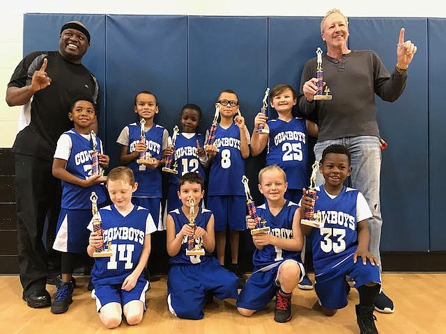 Pleasant Grove Youth Association's first- and second-grade boys' basketball team won the championship. Pictured front row from left are Cutter Runyon, Kaden Kirkwood, Kolby Smith and Karion Bruce. Back row from left are Demazzi Patterson, Tre Bolding, Kevin Nard, Mikah Bolding, Whitten Carmony, coach Neil Carmony and manager Bolding. (Submitted photo)