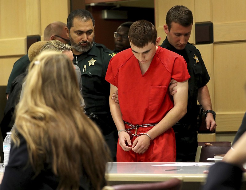 Nikolas Cruz appears in court for a status hearing before Broward Circuit Judge Elizabeth Scherer Monday, Feb. 19, 2018, in Fort Lauderdale, Fla. Cruz is facing 17 charges of premeditated murder in the mass shooting at Marjory Stoneman Douglas High School in Parkland, Fla. (Mike Stocker/South Florida Sun-Sentinel via AP, Pool)