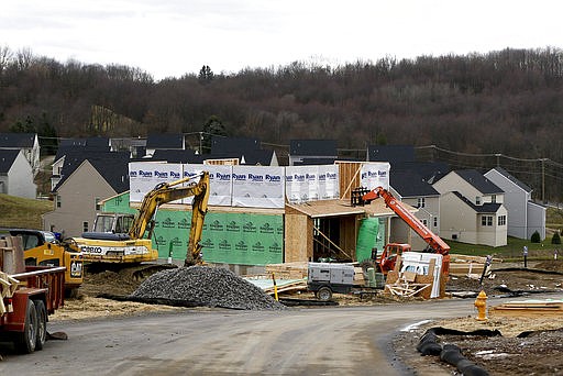 In this March 1, 2017, photo new home construction is underway in a housing plan in Zelienople, Pa. On Friday, Feb. 16, 2018, the Commerce Department reports on U.S. home construction in January. (AP Photo/Keith Srakocic)