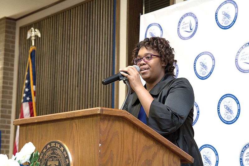 Katie Thompson, a high school senior and president of the Zeta Phi Beta youth chapter, speaks Saturday night at the 23rd annual Tribute to African American Women Awards Banquet at Texarkana College.