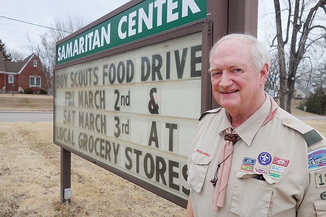 Scouting for Food Coordinator John Young stands in front of the Samaritan Center sign advertising the Boy Scout food drive he is leading March 2-3 at various Jefferson City grocery stores.