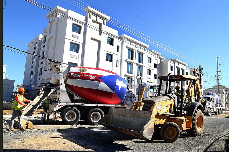 Contractors works on final details at  "Las Gladiolas," a government housing project in San Juan, Puerto Rico, on December 1, 2017. (Pedro Portal/El Nuevo Herald/TNS)