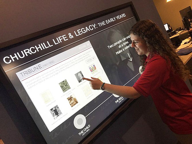 Stacia Schollmeyer, a Westminster freshman from Centertown, browses the new Churchill Life and Legacy Interactive Exhibit, composed of three massive touch screen monitors which provide a timeline of Churchill's life from early childhood to his death in 1965. The exhibit may be seen at the National Churchill Museum in Fulton.