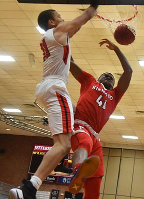 DaMani Jarrett of Jefferson City throws down a dunk during overtime in Monday's game against Kirkwood at Fleming Fieldhouse.
