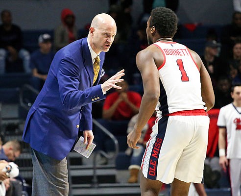 Andy Kennedy speaks with Deandre Burnett during Mississippi's game against Arkansas last Tuesday in Oxford, Miss. Missouri will host Mississippi, now without Kennedy, tonight at Mizzou Arena.