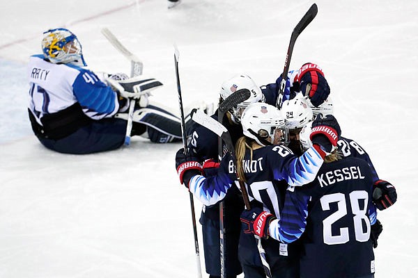 Players from the United States celebrate after a third-period goal during Monday's game against Finland in Gangneung, South Korea.