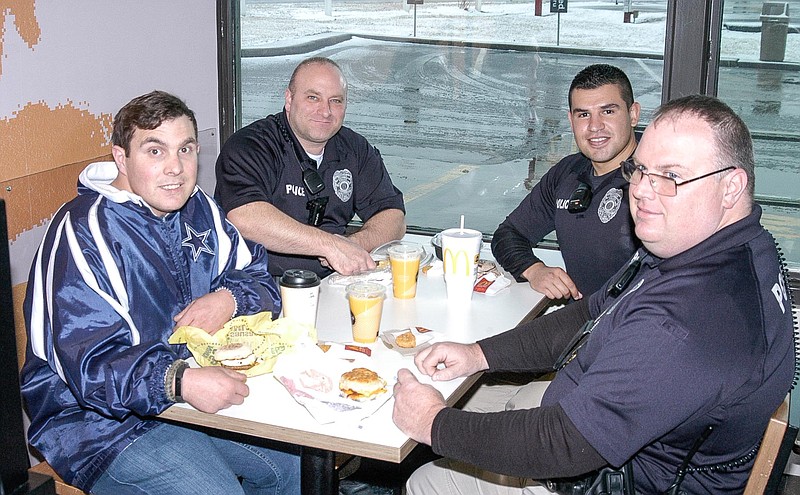 <p>Democrat photo / David A. Wilson</p><p>Brian Perry, left, enjoyed a breakfast outing at McDonald’s with several California Police officers, from left, Jeff Lewis, Rafael Ayala and Capt. Dale Embry on Feb. 17. The breakfast was only the first part of the birthday outing, arranged by his grandmother, Janice Anderson. Perry resides in Columbia.</p>