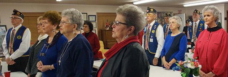Listening as their close friends and relatives are honored by the J.E. Manning American Legion Post 258 are, at the first table from left, Roger Matlock, Marcie Matlock, Melba Hopper, Peggy Wadsworth and Peggy Dupree. At the second table, from left are Sue Berry, John and Barbara Fox and Jackie Cannon.