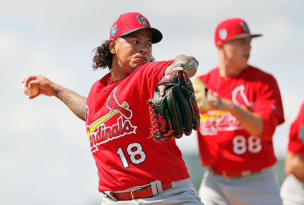 Cardinals pitcher Carlos Martinez throws a bullpen session last week during spring training practice in Jupiter, Fla.