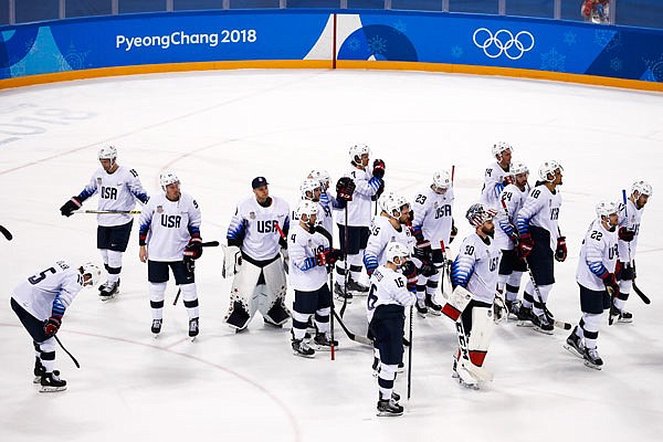 Members of the United States team gather on the ice after Wednesday's quarterfinal round loss to the Czech Republic at the Winter Olympics in Gangneung, South Korea.