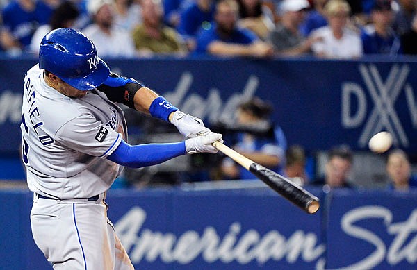 In this Sept. 20, 2017, file photo, Whit Merrifield of the Royals hits a solo home run against the Blue Jays during the sixth inning of a game in Toronto.