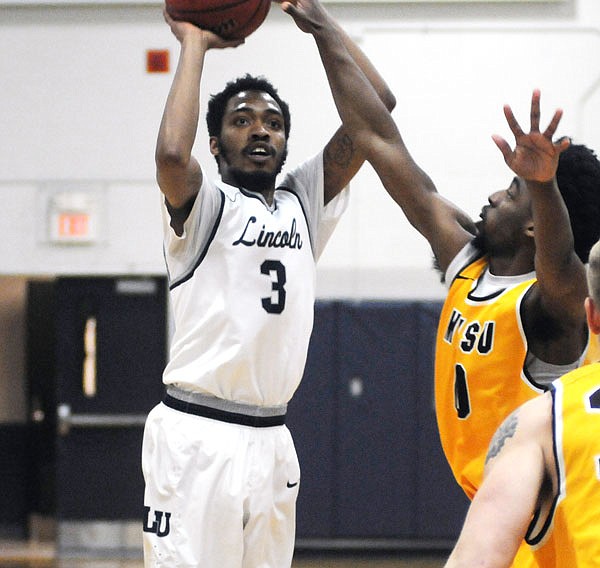 Lincoln's Maurice Mason pulls up for a jump shot during Thursday night's game against Missouri Western at Jason Gym. Mason scored 20 points for the Blue Tigers.