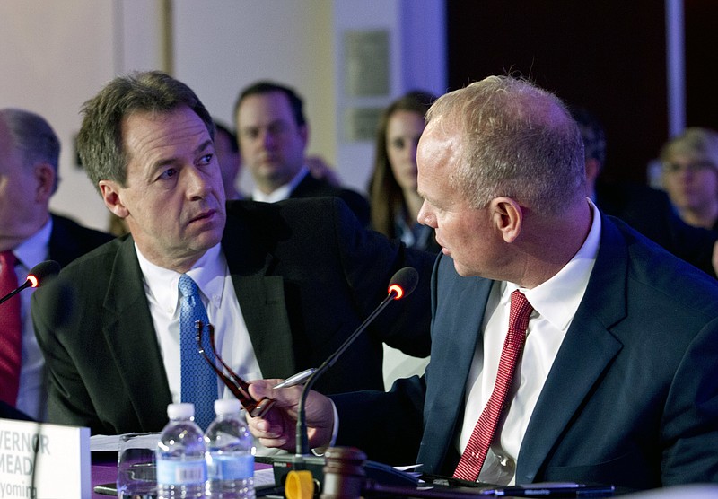 Gov. Steve Bullock speaks with Gov. Matt Mead of Wyoming during the National Governor Association 2018 winter meeting, on Saturday, Feb. 24, 2018, in Washington. (AP Photo/Jose Luis Magana)