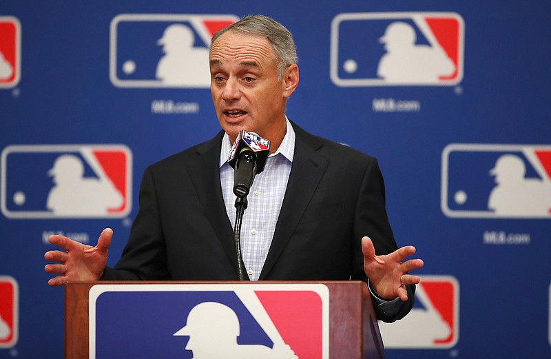 FILE - In this Feb. 20, 2018, file photo, Major League Baseball Commissioner Rob Manfred gestures while speaking at an owners meeting in Glendale, Ariz. A person familiar with the negotiations tells The Associated Press a proposal collapsed that would have had a runner on second base at the start of 10th innings in spring training games. The person spoke on condition of anonymity because no statements were authorized.
The person said management thinks the union backed off because players were upset Commissioner Manfred described new pace-of-game rules that apply to the regular season as an agreement. (AP Photo/Ben Margot, File)